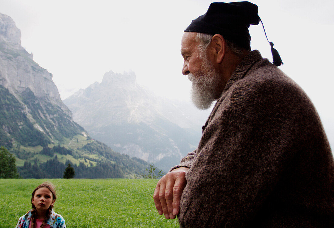 Old man and young girl are looking at each other, Interlaken, Graubünden, Switzerland