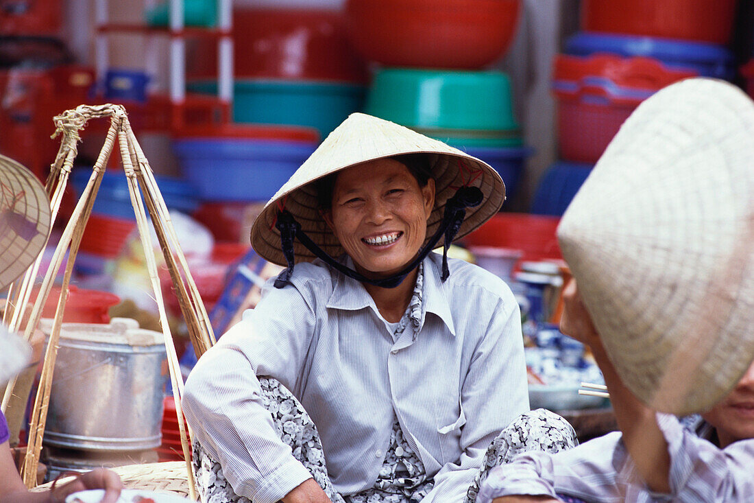 A local woman, vendor at a market, City Life, Hoi An, Vietnam
