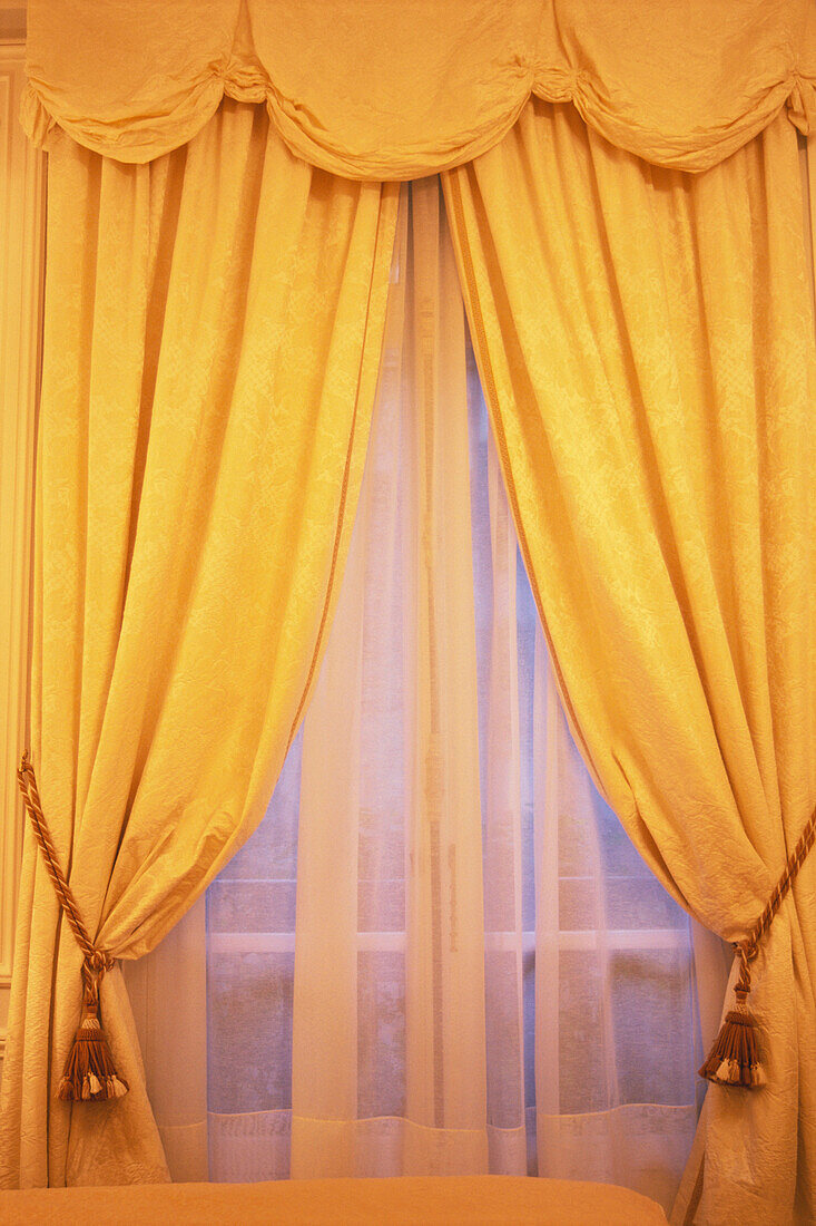 Yellow curtains in Hotel Plaza Athenee, Paris, France