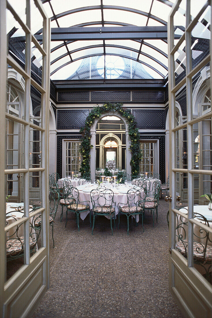 Inside Restaurant L'Orangerie with glass roof, Los Angeles, California, USA
