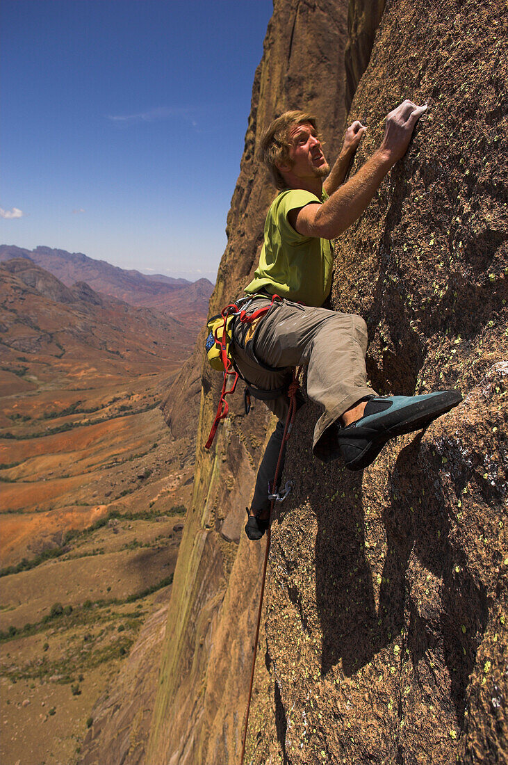 Free climber scaling rock face, Tsaranoro Be, Andringitra National Park, Madagascar