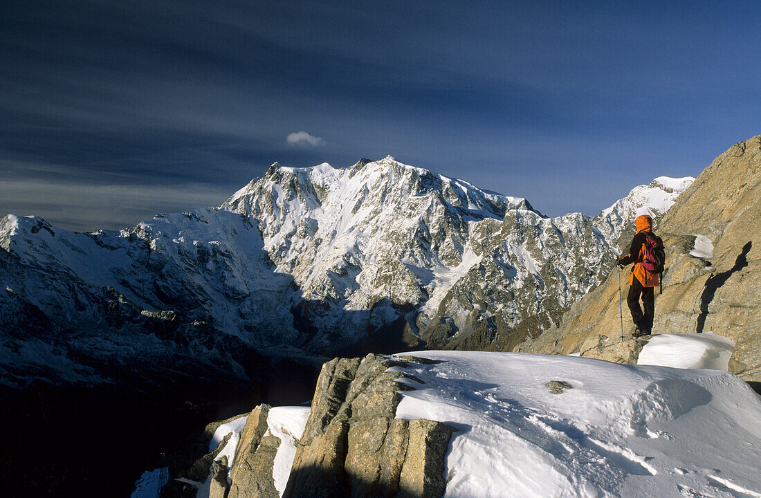 Mountaineerer at Monte Moro-Pass with view to east face of Monte Rosa, Mischabel range, Valais, Switzerland