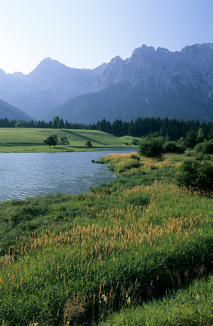 meadows at lake Schmalensee with Karwendel range, Upper Bavaria, Bavaria, Germany