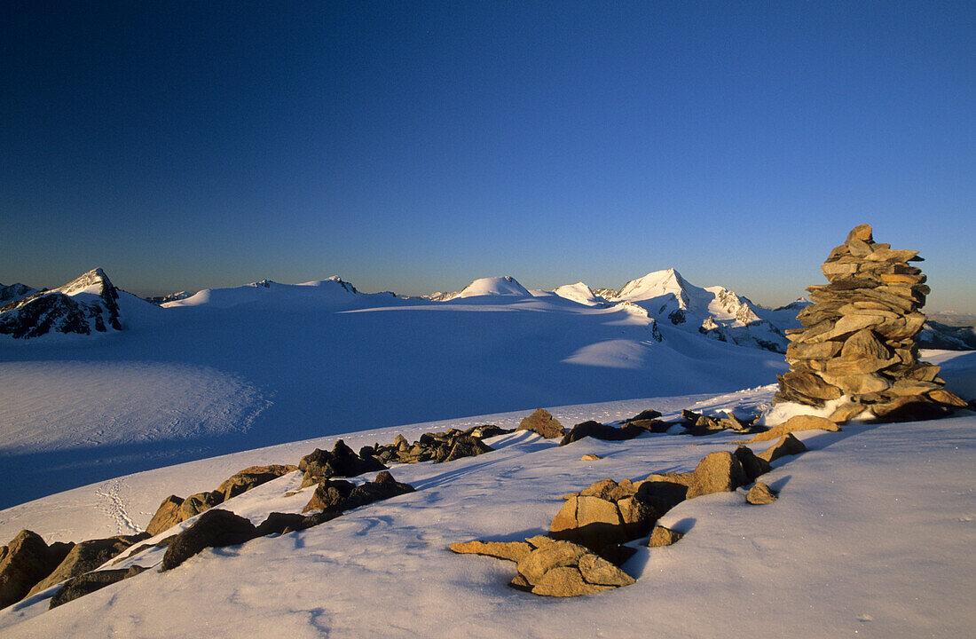 cairn on Dahmannspitze with view to Weißkugel, Ötztal range, Tyrol, Austria