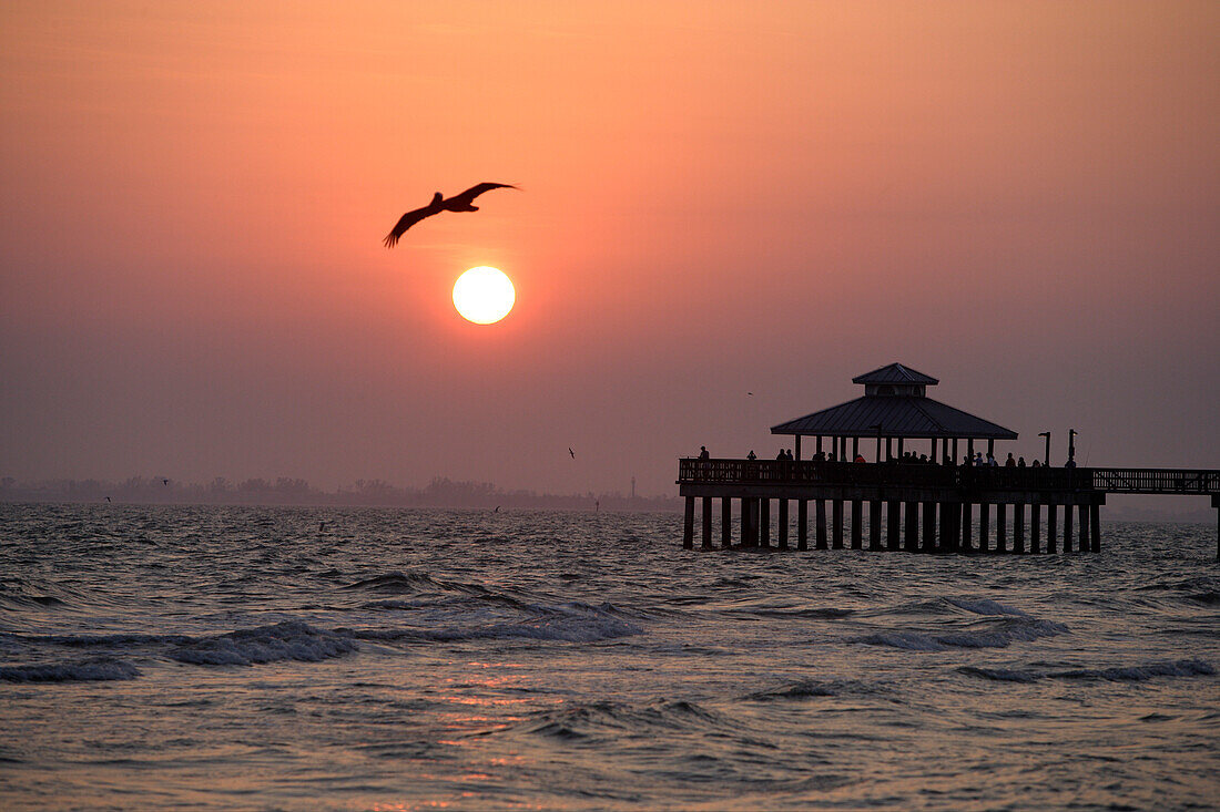 Sunset and the pier of Fort Myers Beach, Florida, USA