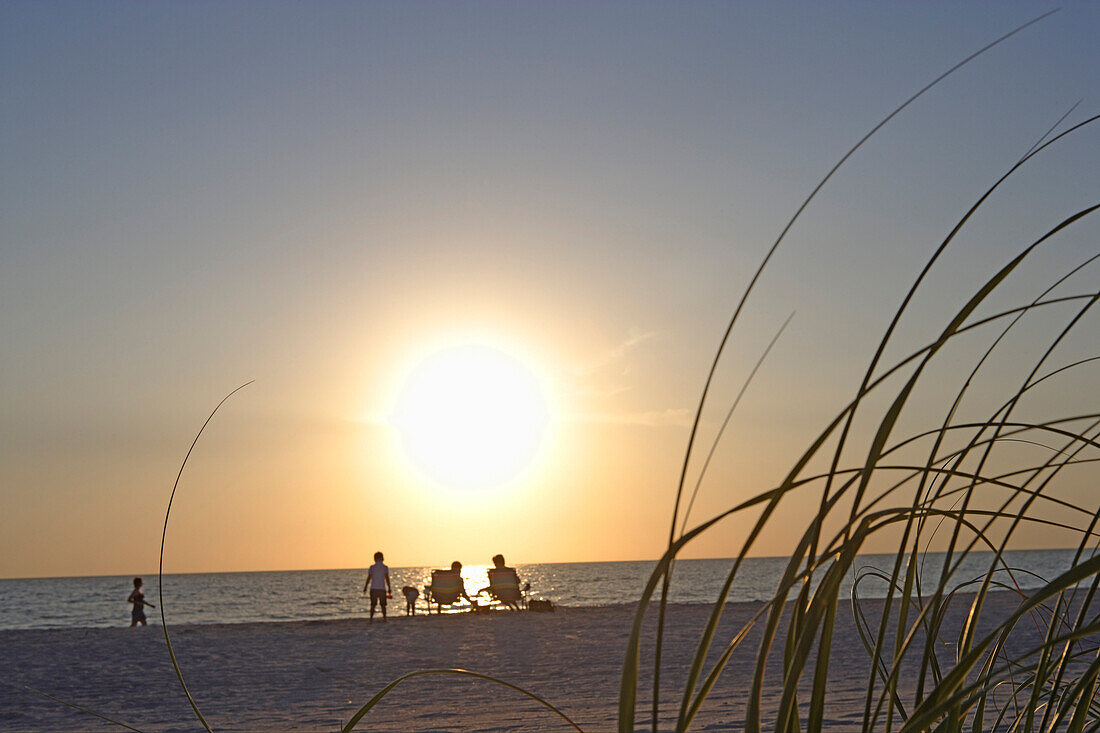 Tourists enjoying sunset at beach, Sylt Island, North Frisian, Schleswig-Holstein, Germany