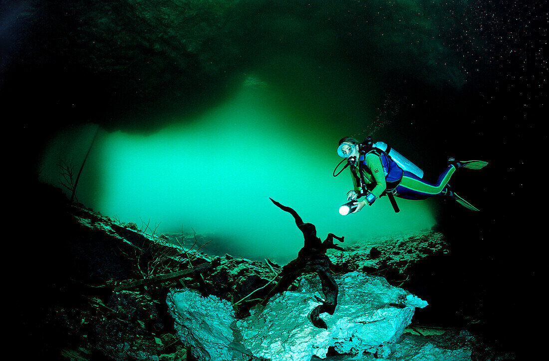 Scuba diver in underwater cave Laguna Pepe, Punta Cana, Freshwater, Dominican Republic