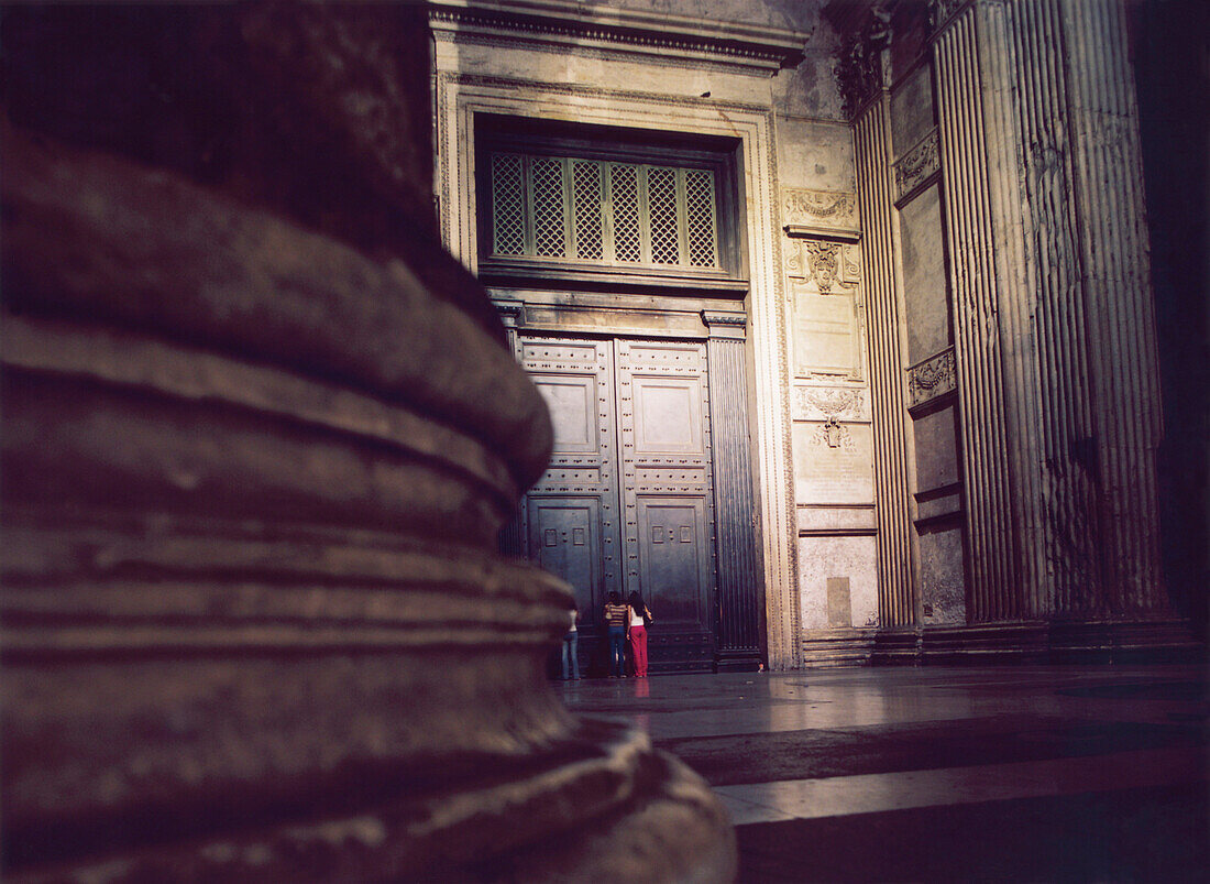Pantheon, tourists knocking on the entrance door at night, Piazza della Rotonda, Rome, Italy