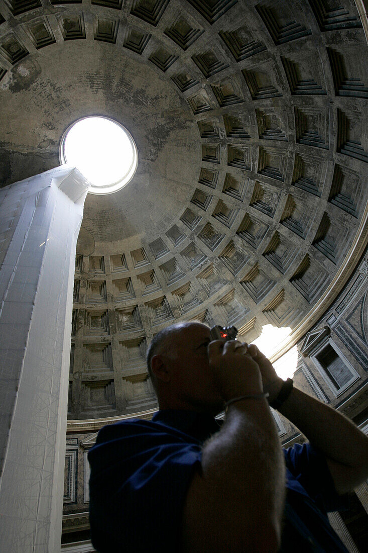 Tourist taking pictures inside the Pantheon, Rome, Italy