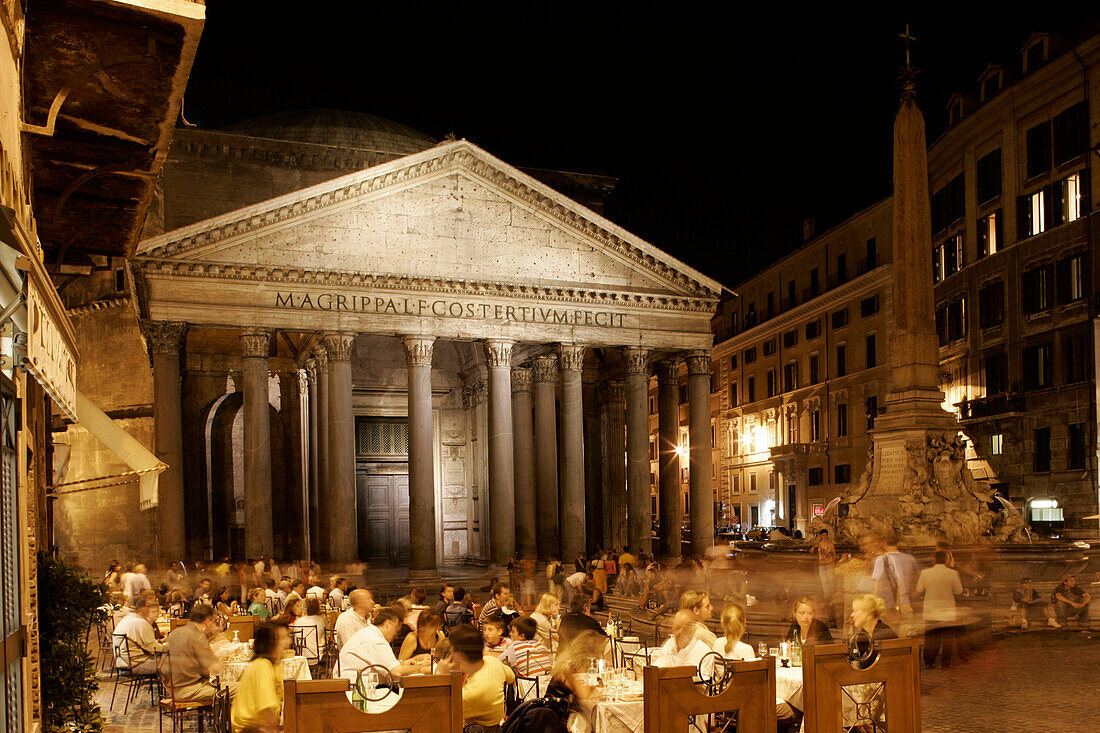 Restaurant tables at Piazza della Minerva, Pantheon, in the evening, Rome, Italy