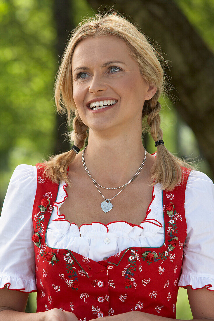 Smiling mid adult woman wearing dirndl dress