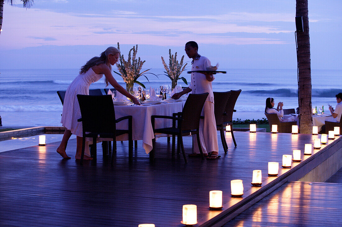 A romantic candlelight dinner overlooking the sea, near Uluwatu, Bali, Indonesia