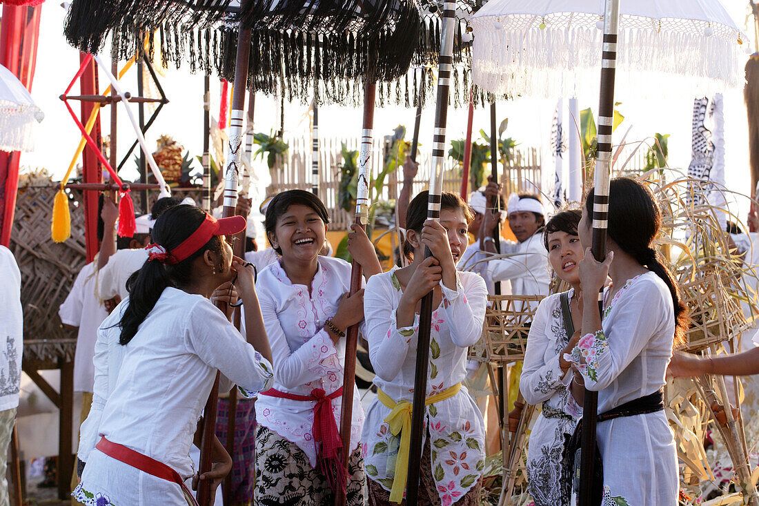 Locals at a Balinese Festival on the beach, Seminyak Beach, Bali, Indonesia