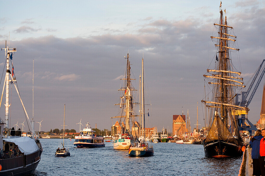 Sailing ships on river Warnow in city harbor, Hanse Sail, Rostock, Mecklenburg-Western Pomerania, Germany