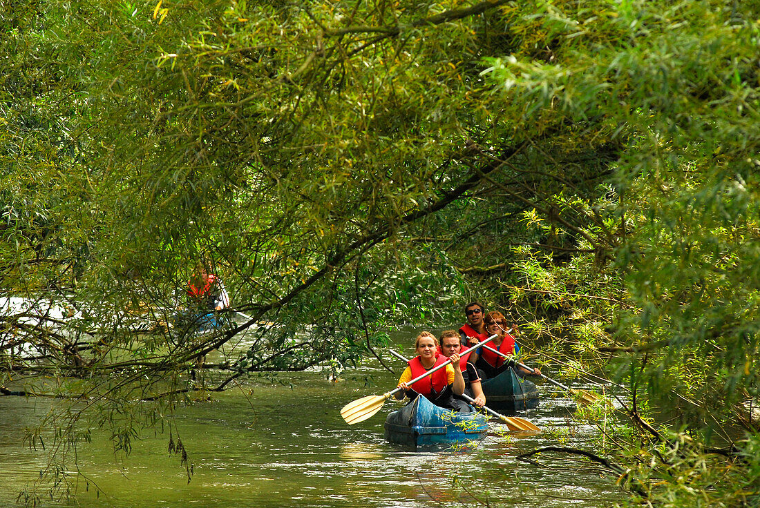 People in a canoe on the Werra river near Breitungen, Thuringia, Germany