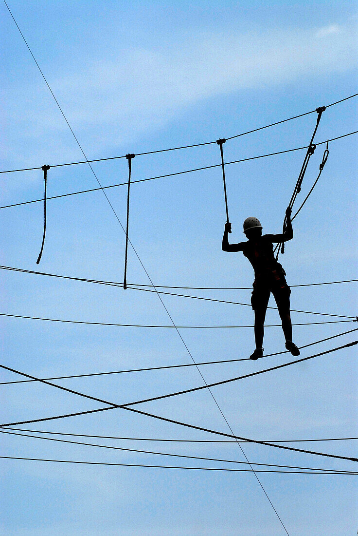 A climber on a high rope course in Steinach, Thuringia, Germany