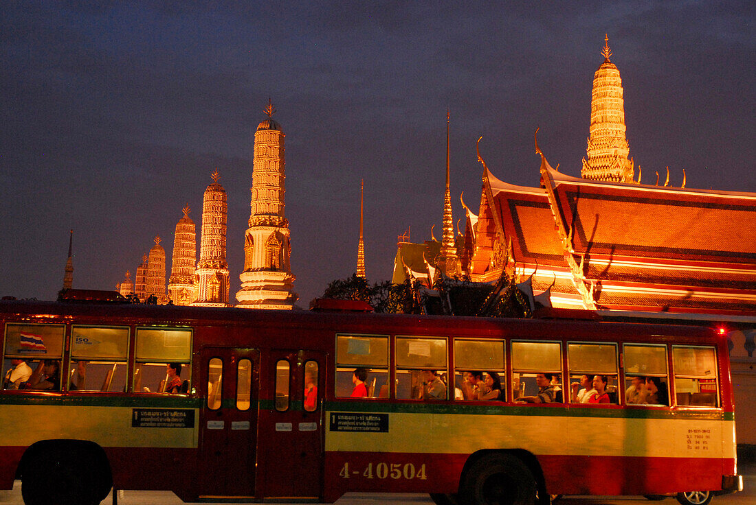 Evening traffic in front of Wat Phra Kaeo Temple, Bangkok, Thailand