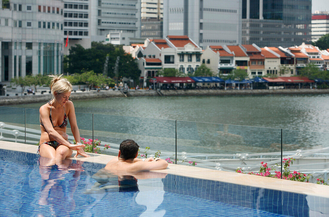 Couple in pool, Fullerton Hotel, Singapore