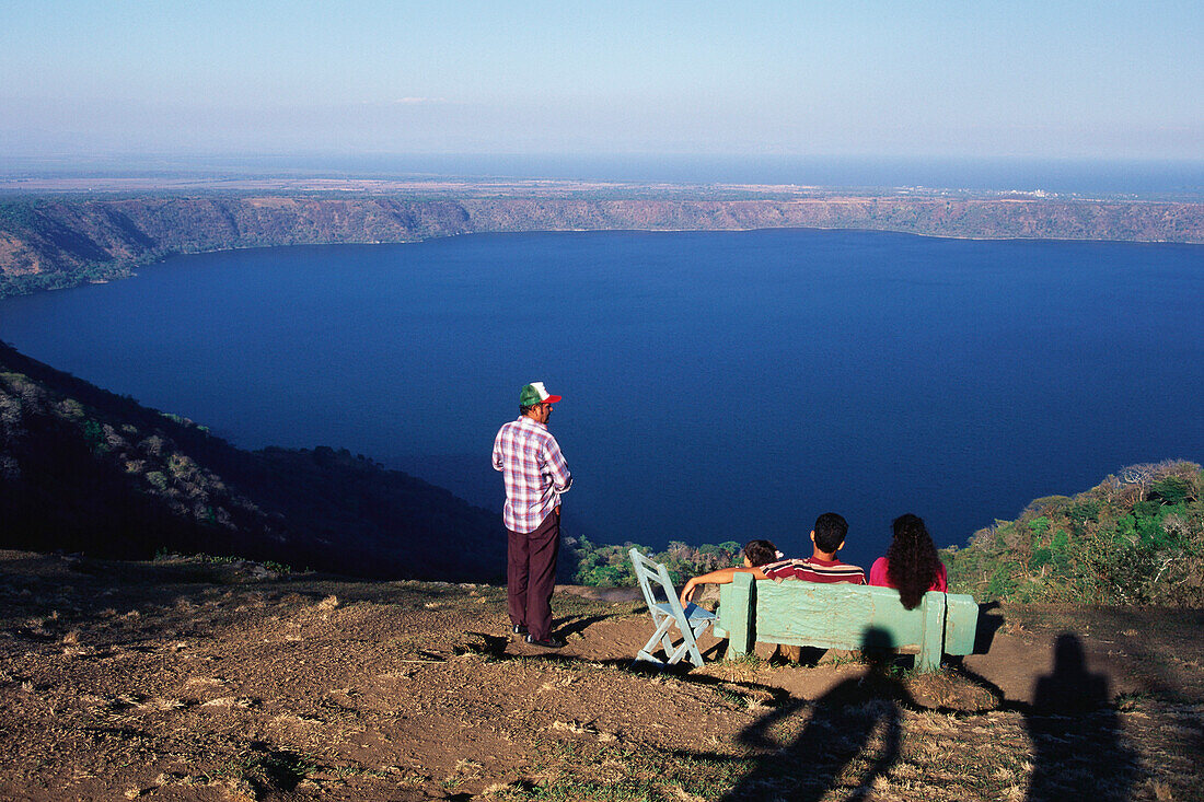 A family enjoying the view from Mirador de Catarina over Laguna de Apoyo, Lake Nicaragua, Nicaragua, Central America