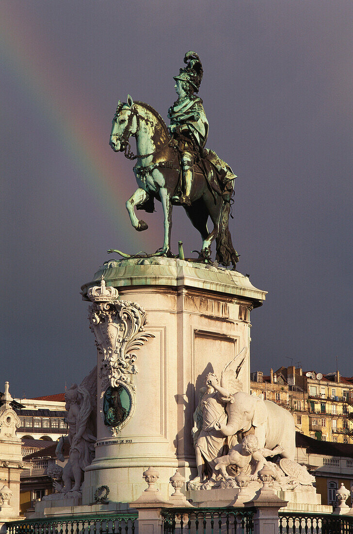 Statue of King D. Jose I, Praca do Comercio, rainbow in the background, Baixa, Lisbon, Portugal