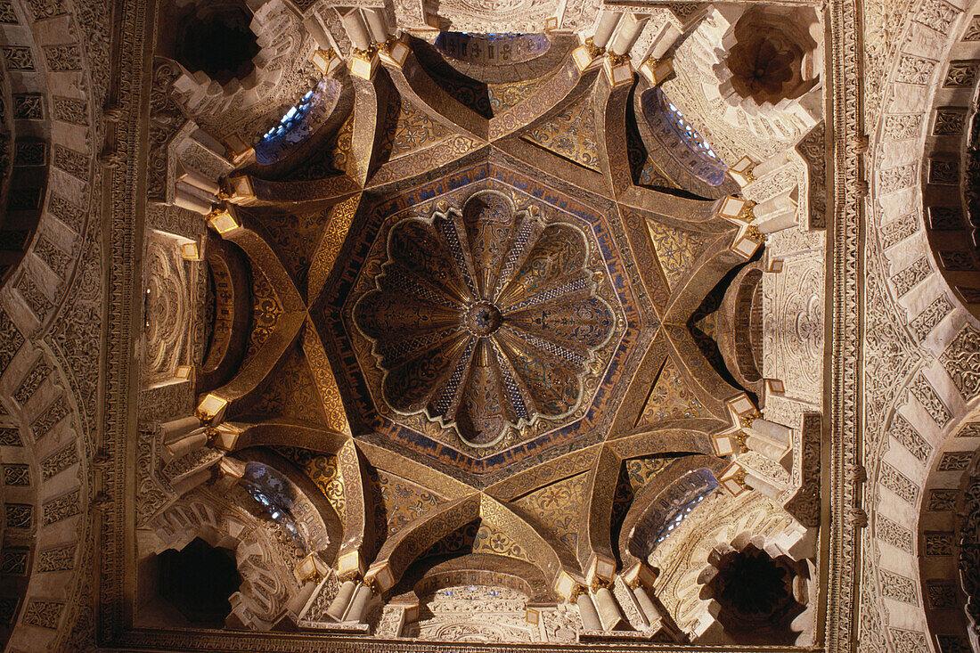 View from beneath into the octagonal gilded dome of the Great Mosque Mezquita in Cordoba, Andalusia, Spain