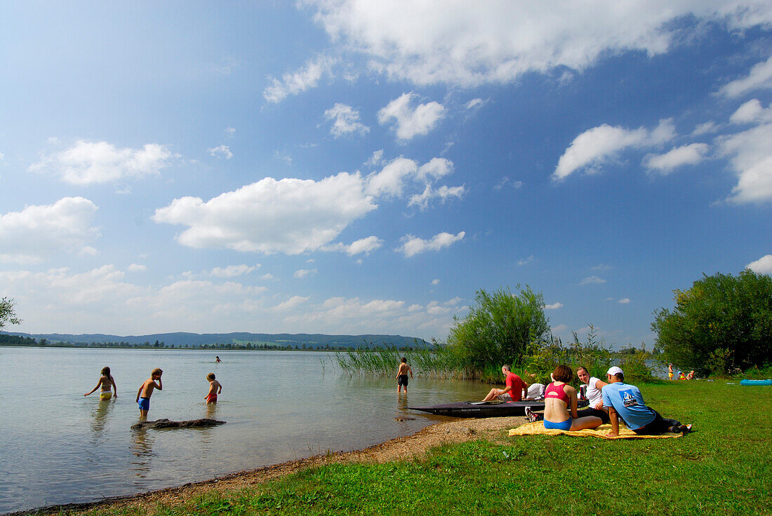 bathers at shore of lake Kochelsee, Upper Bavaria, Bavaria, Germany