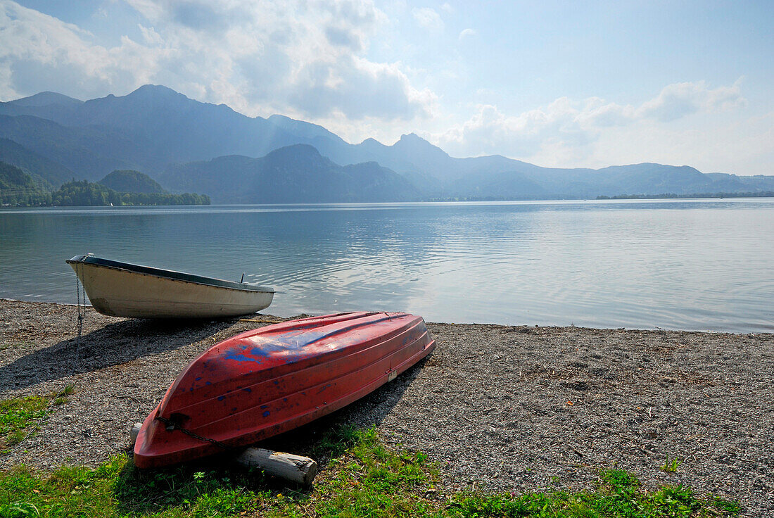 Two boats at shore of lake Kochelsee, Bavarian Alps in background, Upper Bavaria, Bavaria, Germany