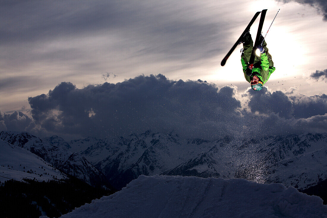 Skier jumping in the sunset, See, Tyrol, Austria