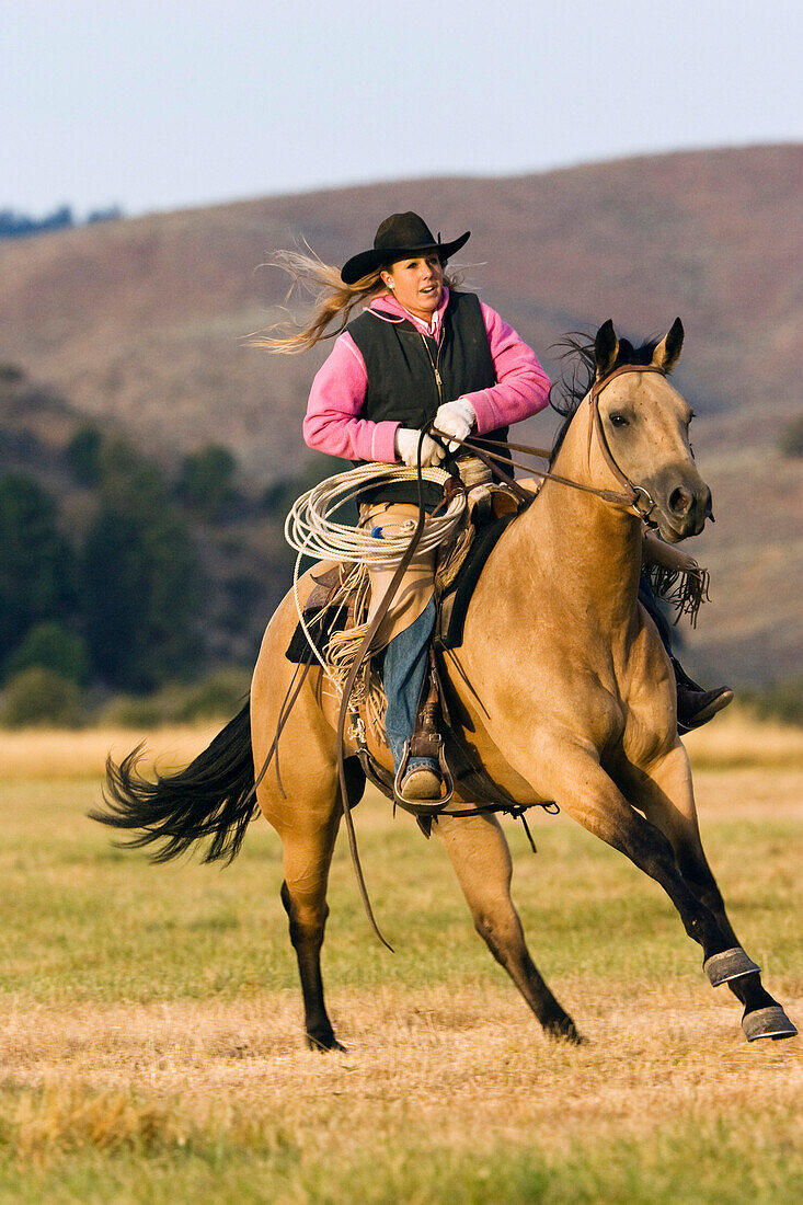 cowgirl riding, Oregon, USA