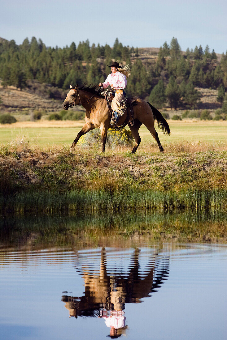 cowgirl riding, Oregon, USA