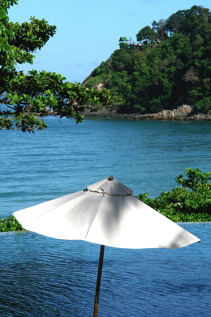 Sun shade on the pool, sea in the backround,  Koh Lanta, Ko Lanta, Thailand, Asia