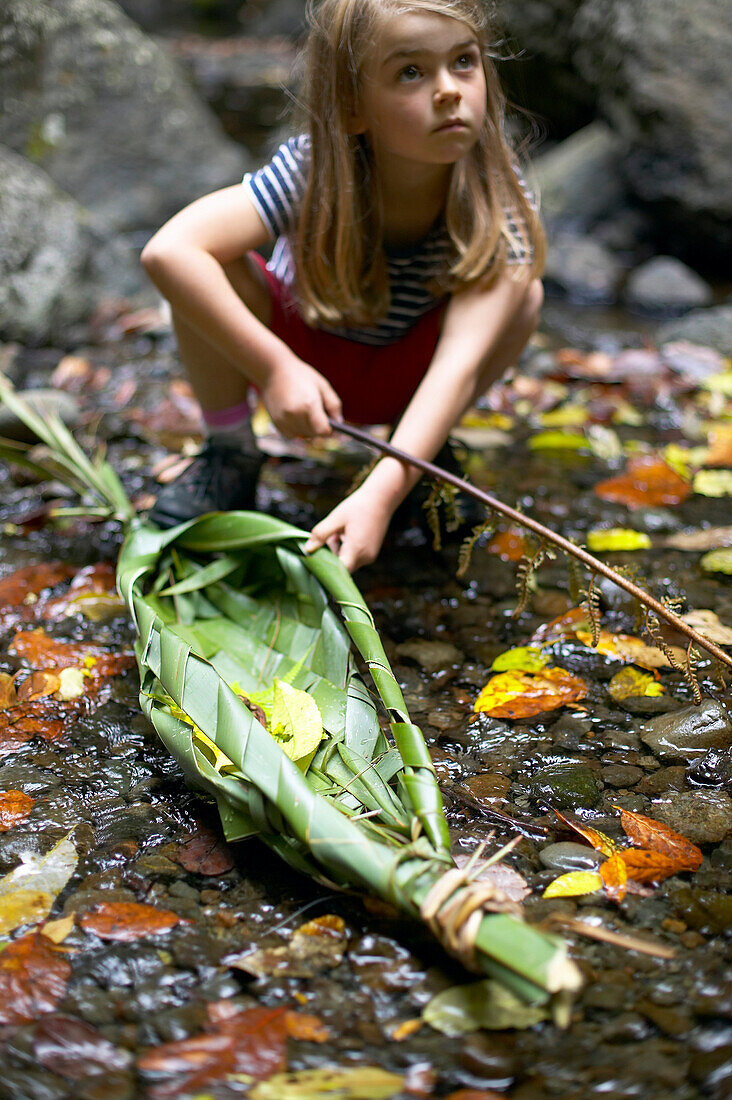 New Years Day: self-made boat (New Zealand flachs) will carry our wishes for the year, cascades, waterfall near Opononi, Northland, North Island, New Zealand
