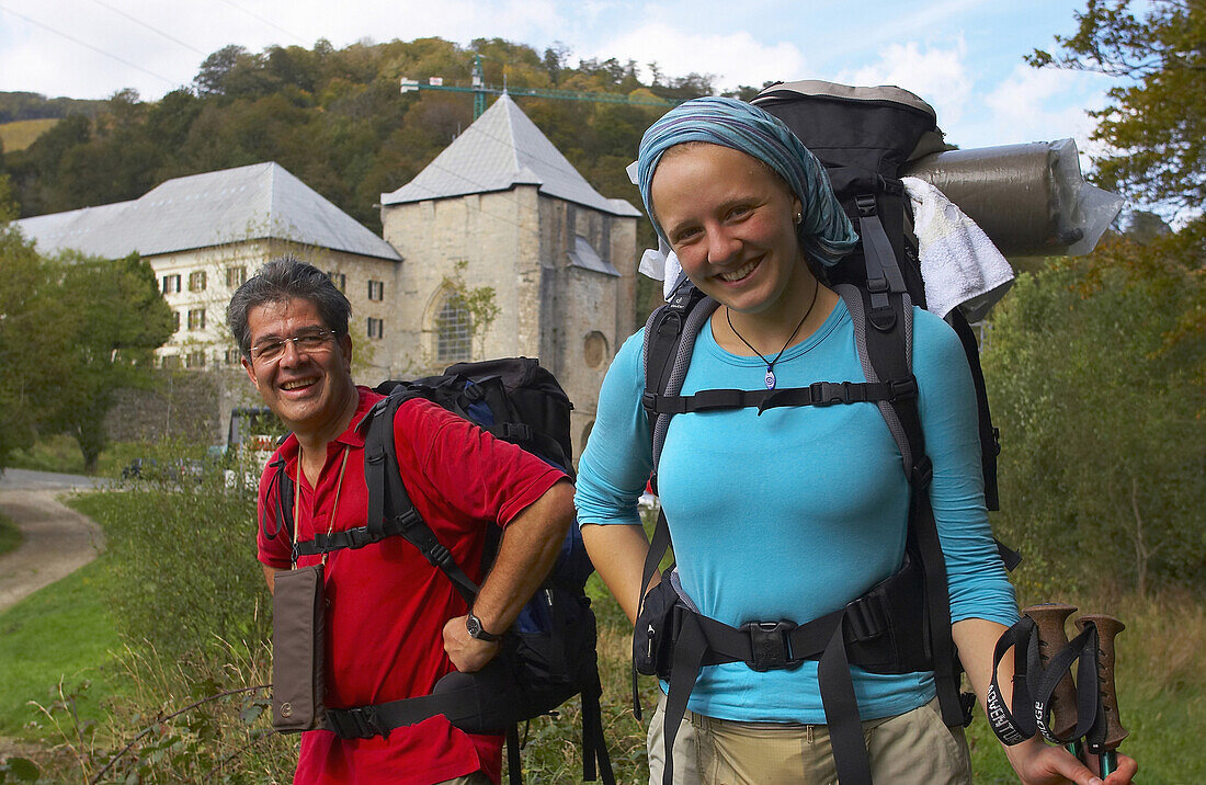 Two pilgrims on the Camino de Santiago, at Roncesvalles, Pyrenees, Navarra, Spain