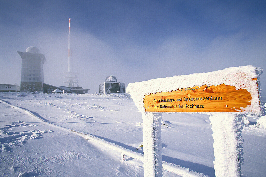 Snow covered sign post on Brocken summit, Schierke, Harz Mountains, Saxony-Anhalt, Germany