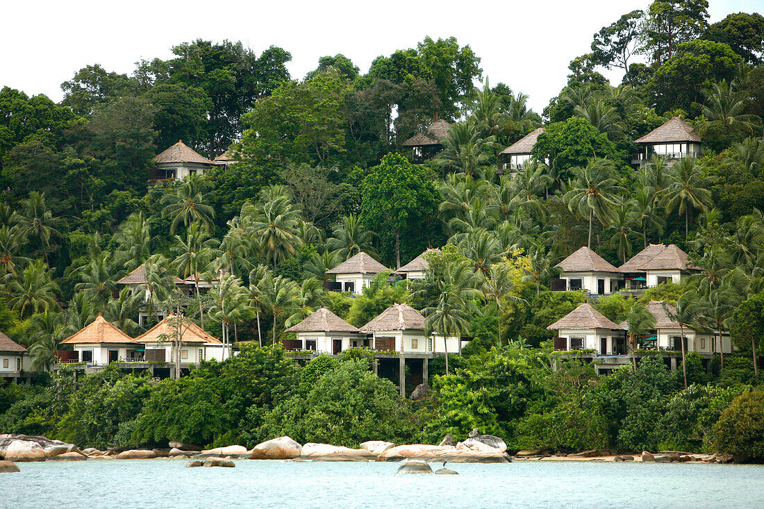 Bungalows at beach, Banyan Tree Resort, Bintan Island, Indonesia