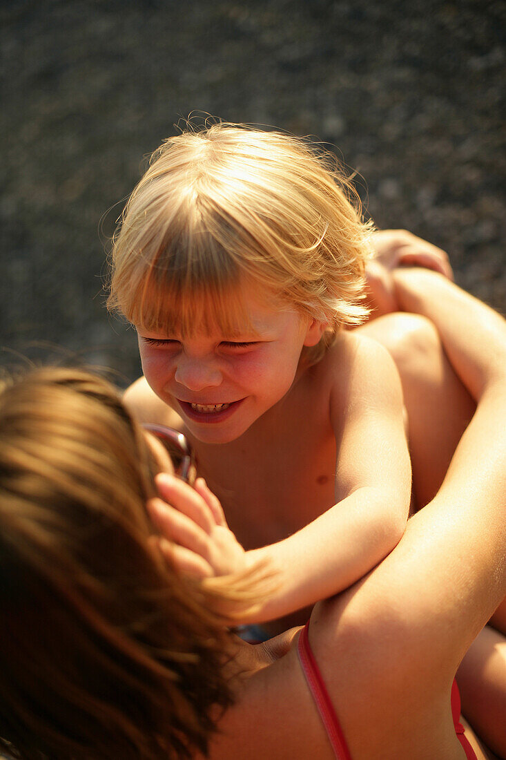 Smiling mother and son face to face, Ammerland, Bavaria, Germany