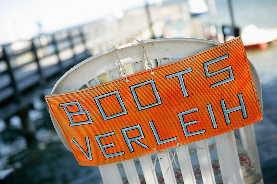 Boat rental sign on a chair, Diessen, Lake Ammersee, Bavaria, Germany