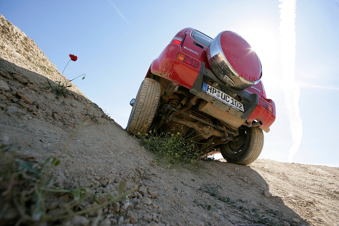 A Suzuki Jimnys driving cross country, Test Grounds, Suzuki Offroad Camp, Valencia, Spain