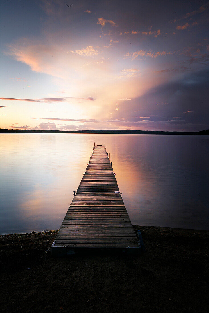 Jetty at a lake at sunrise Madkroken near Växjö, Smaland, Sweden