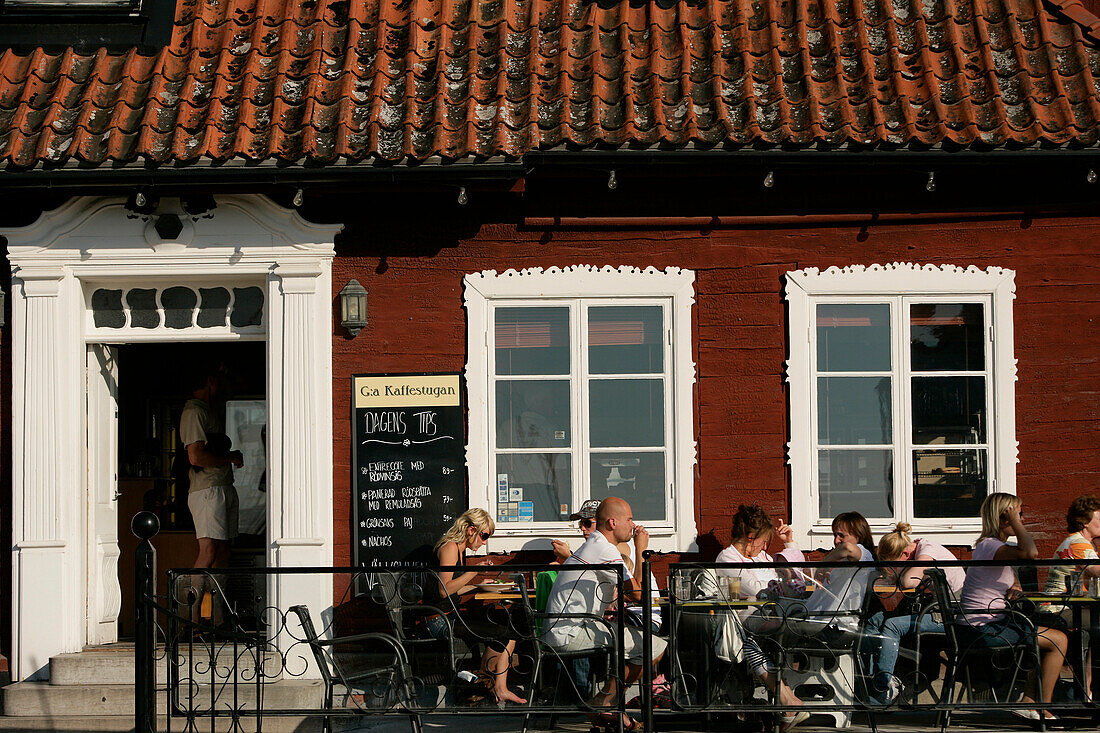 People sitting outside a street cafe, Kaffestugan, Visby, Gotland, Sweden