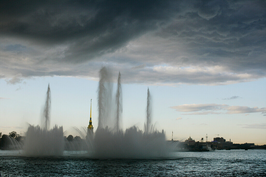 Fountain in the river Newa, Peter and paul church in the background, during midsummer night or white night, St. Petersburg, Russia