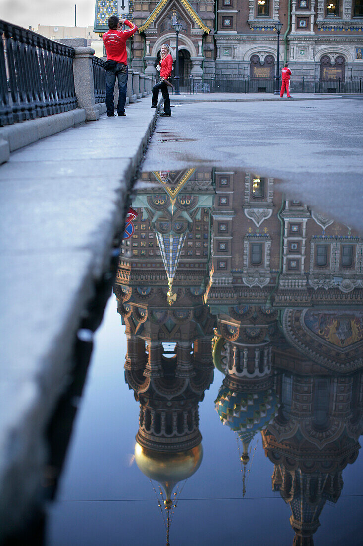 Cathedral of the Resurrection of Christ reflected in a puddle, St. Petersburg, Russia