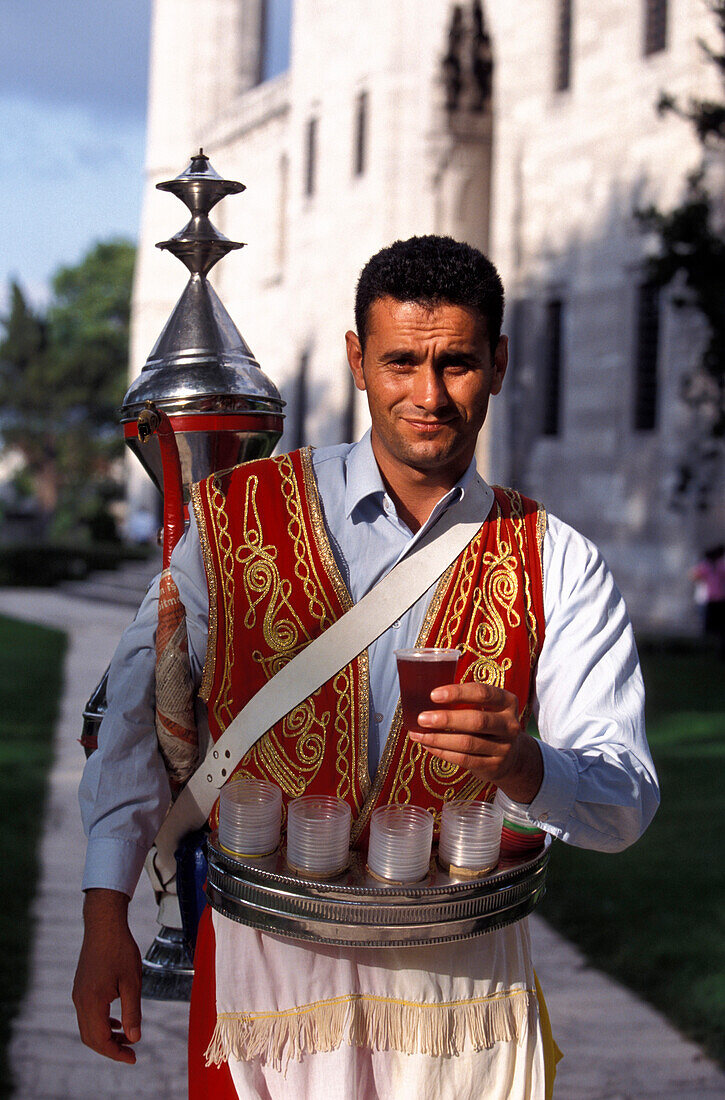 Man offering tea, Süleymaniye Mosque, Istanbul, Istanbul, Turkey