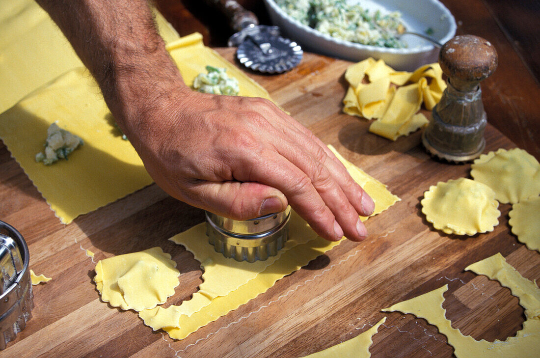 Man preparing pasta, restaurant La Campagnola, Salo, Lake Garda, Lombardy, Italy