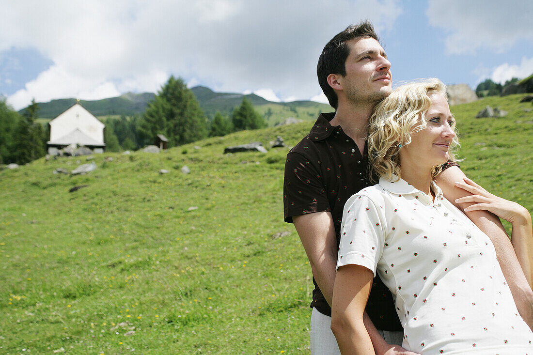 Young couple on alp, Heiligenblut, Hohe Tauern National Park, Carinthia, Austria