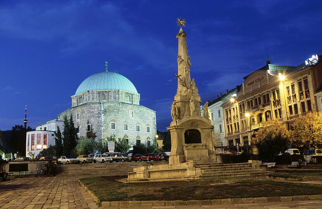 Széchenyo square: Holy Trinity column and Mosque of pasha Gazi Khassim. Pécs. Hungary