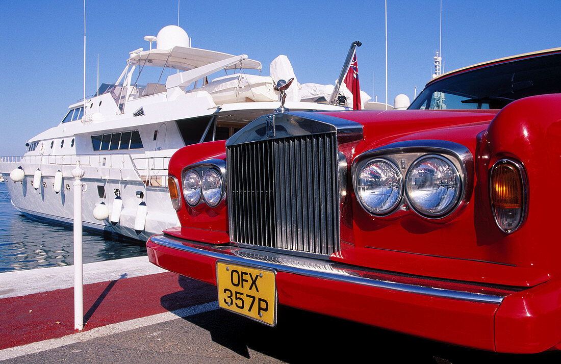 Rolls Royce and luxurious yacht in Puerto Banus. Marbella. Malaga province. Costa del Sol. Andalucia. Spain