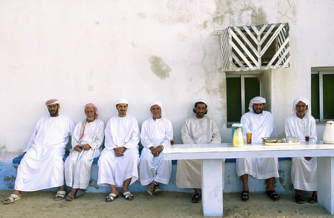 Group of friends having tea. Musandam peninsula. Oman