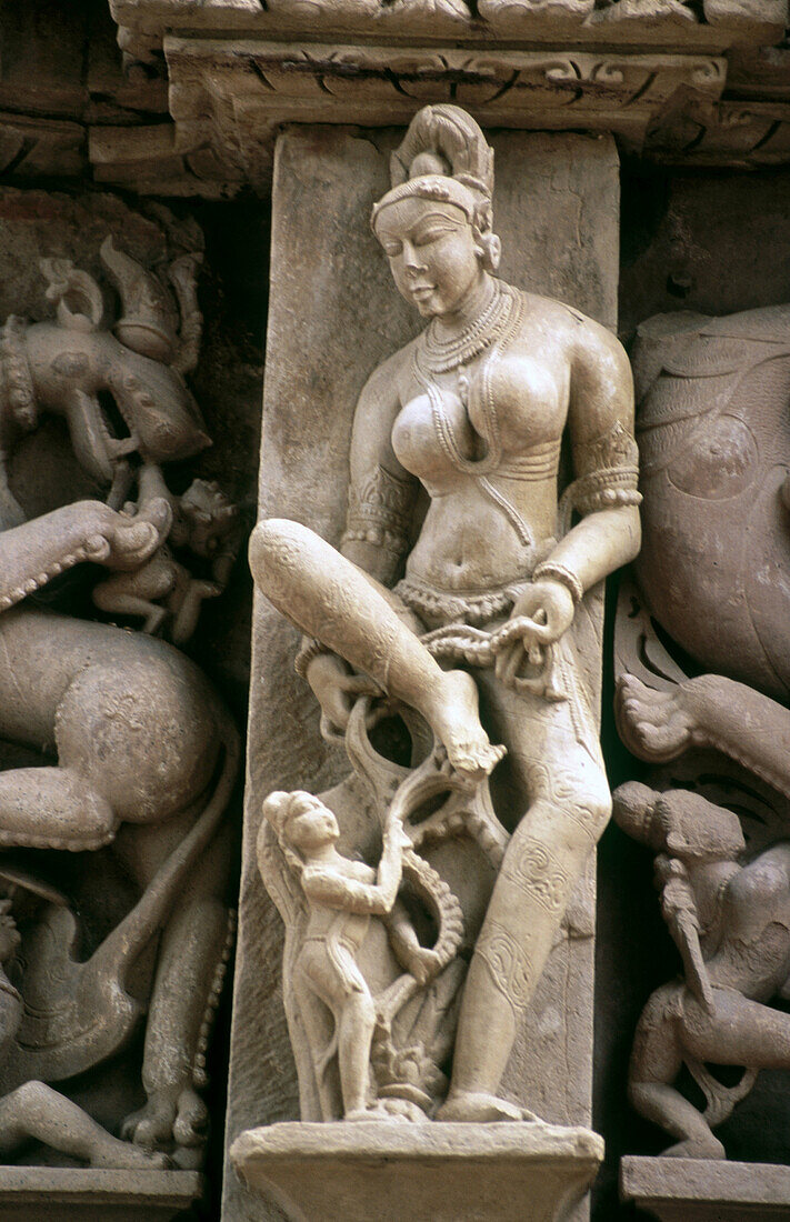 Woman richly stone carved figure, Paraswanath Temple, Khajuraho. Madhya Pradesh, India