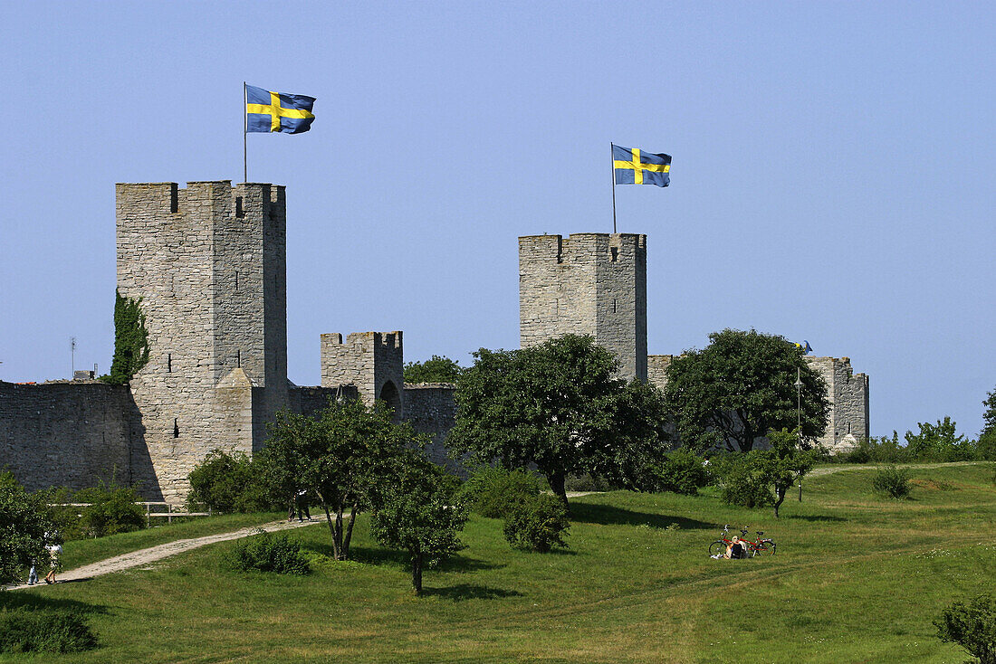 Swedish flags on the old town wall in Visby. Sweden